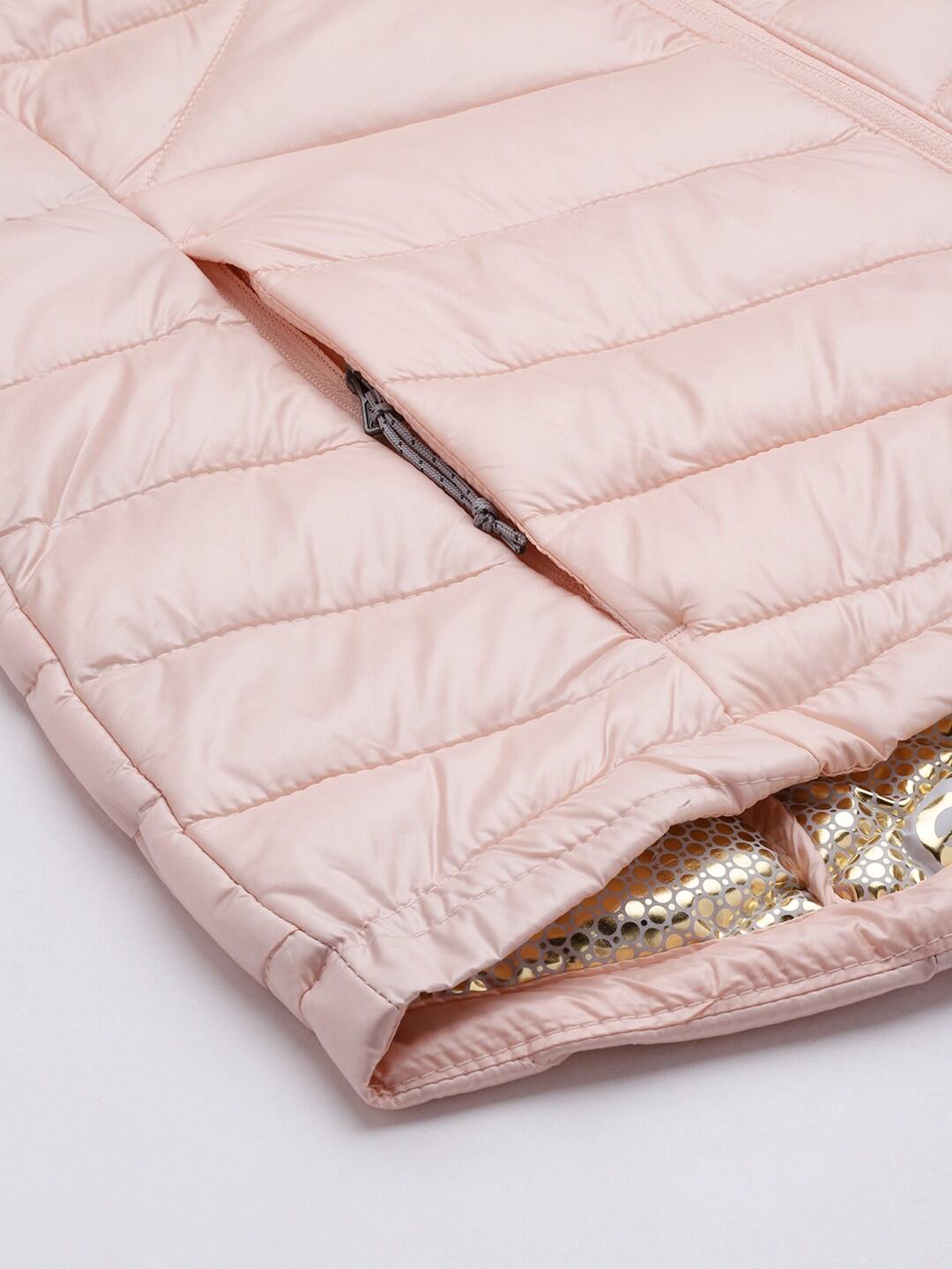 A Women Wearing Columbia Women Peach Joy Peak Jacket