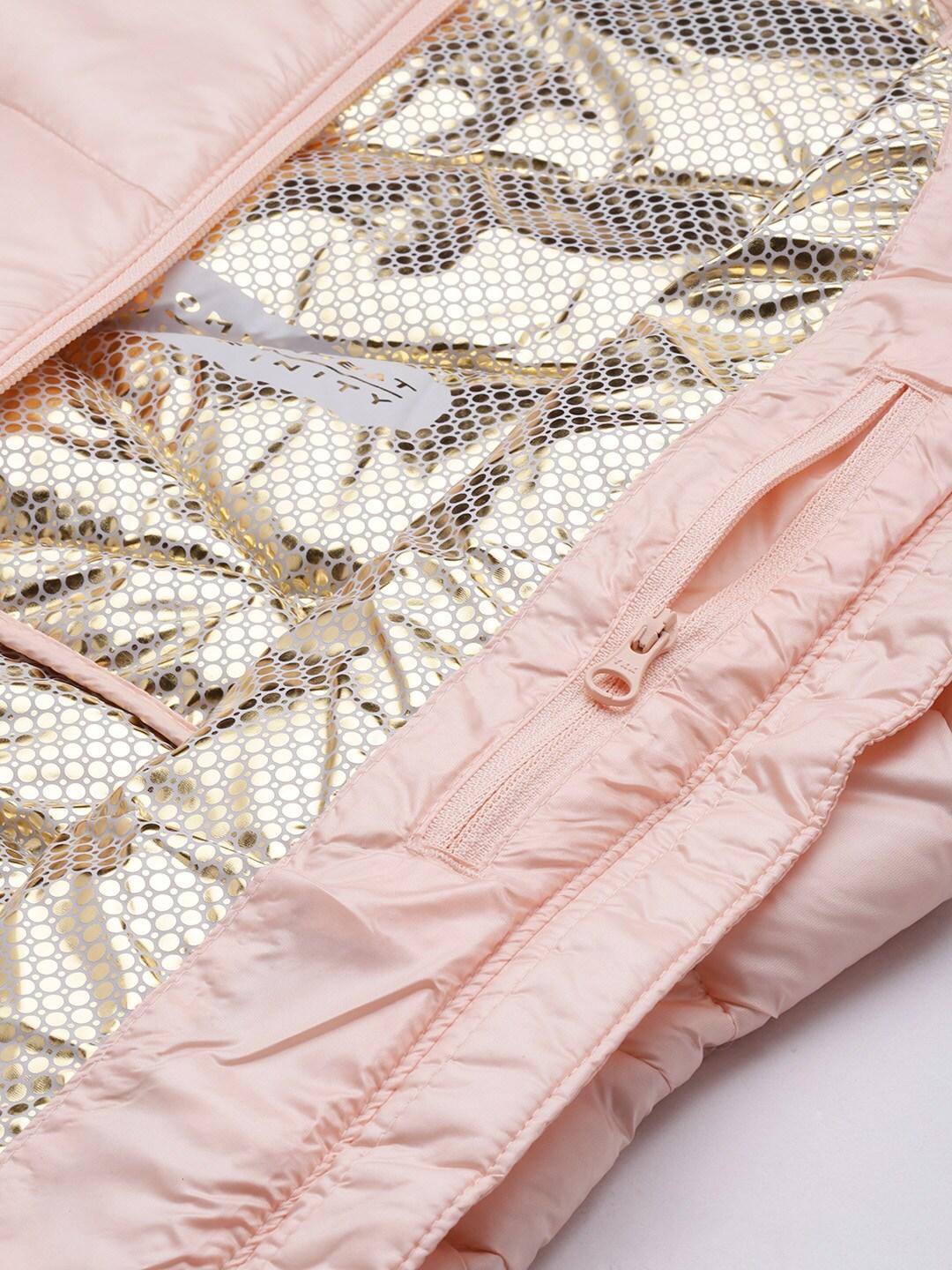 A Women Wearing Columbia Women Peach Joy Peak Jacket