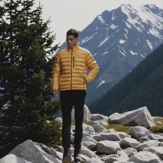 A Men Wearing Columbia Men Yellow Pebble Peak Down Jacket